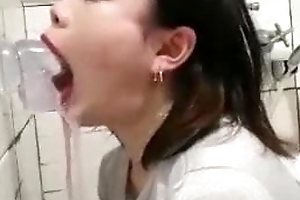 Stunning Asian deepthroating her dildo