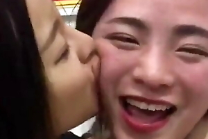 Chinese girl passionately kiss in restaurant