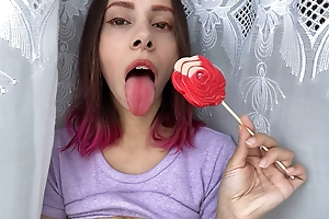 Naughty stepsister sucks a lollipop and shows her long hot sexy tongue