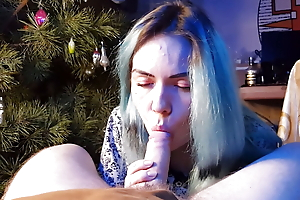 cute asian girl eats cum under the Christmas tree new year 2023