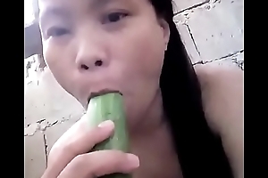Asian masturbating with cucumber