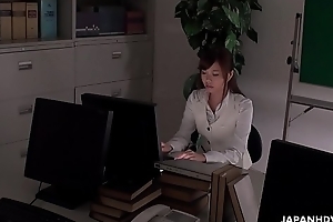 Office worker getting some juice up as her work gets boring