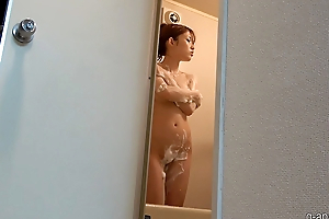 Beautiful japanese girl takes a shower
