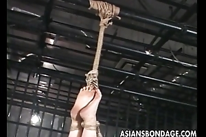 Asian hottie tied up to try a bdsm session